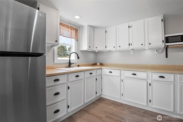 1580 134th Ln, Long Beach, WA 98631 - kitchen featuring appliances with stainless steel finishes, white cabinetry, light countertops, and recessed lighting