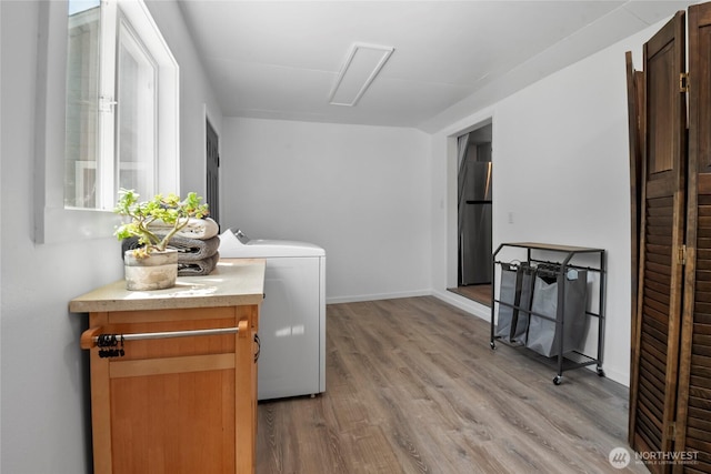 1580 134th Ln, Long Beach, WA 98631 - laundry room featuring light wood-type flooring and washer / clothes dryer