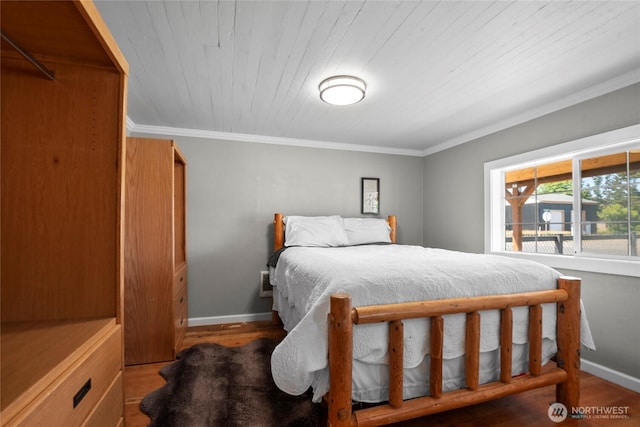 1580 134th Ln, Long Beach, WA 98631 - bedroom featuring wood finished floors, ornamental molding, and wooden ceiling