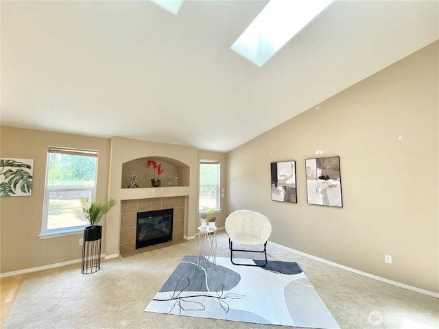 2218 143rd Street Ct S, Spanaway, WA 98387 - sitting room featuring carpet flooring, a tile fireplace, a skylight, and lofted ceiling