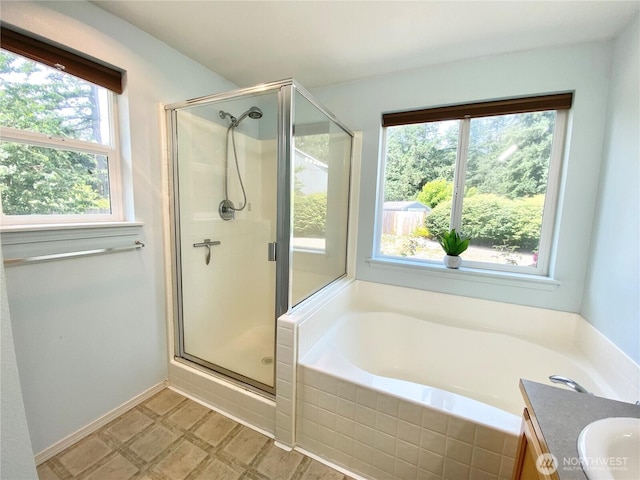 2218 143rd Street Ct S, Spanaway, WA 98387 - bathroom with a bath, a shower stall, vanity, and tile patterned floors