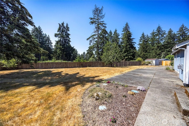 2218 143rd Street Ct S, Spanaway, WA 98387 - fenced backyard with a storage shed and a patio