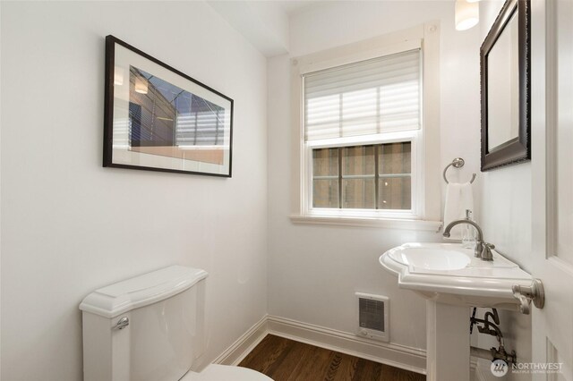 817 E Shelby St, Seattle, WA 98102 - half bathroom with toilet and wood finished floors