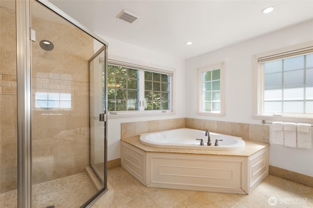 817 E Shelby St, Seattle, WA 98102 - full bath with a garden tub, a shower stall, tile patterned flooring, and recessed lighting