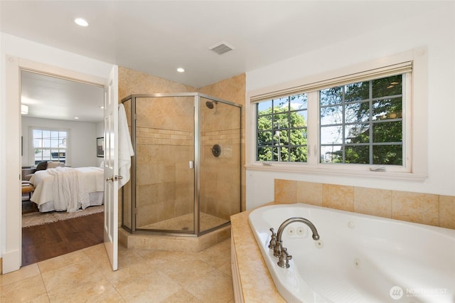 817 E Shelby St, Seattle, WA 98102 - bathroom with connected bathroom, a tub with jets, a stall shower, recessed lighting, and tile patterned floors