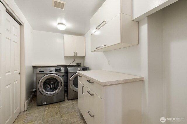 817 E Shelby St, Seattle, WA 98102 - washroom featuring washing machine and dryer and cabinet space