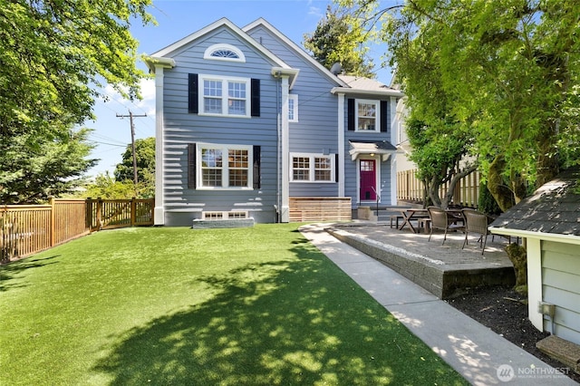 817 E Shelby St, Seattle, WA 98102 - rear view of property with a fenced backyard and a patio