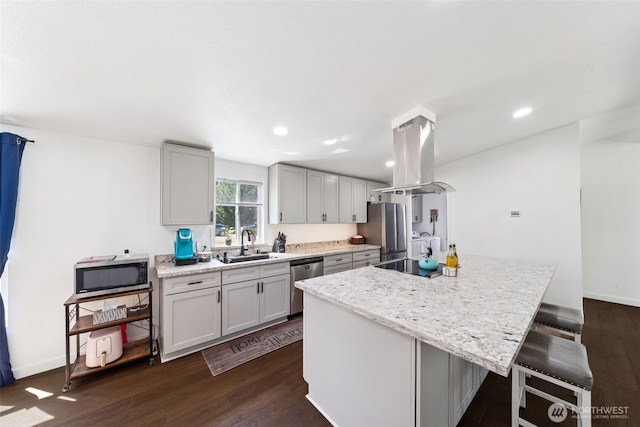 32205 71st Ave S, Roy, WA 98580 - kitchen featuring island range hood, appliances with stainless steel finishes, dark wood-type flooring, a center island, and a breakfast bar