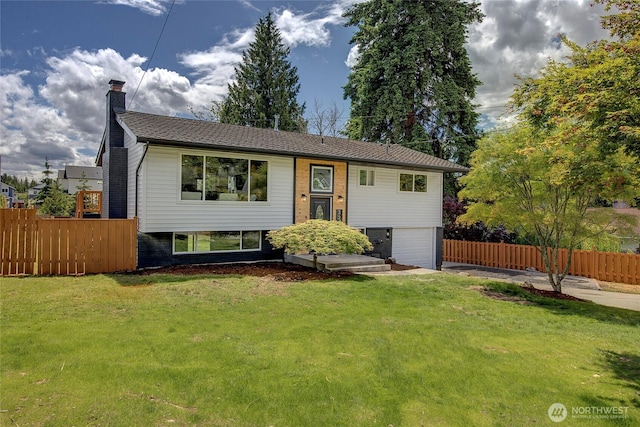 320 178th Pl SW, Bothell, WA 98012 - split foyer home with a chimney, an attached garage, and driveway
