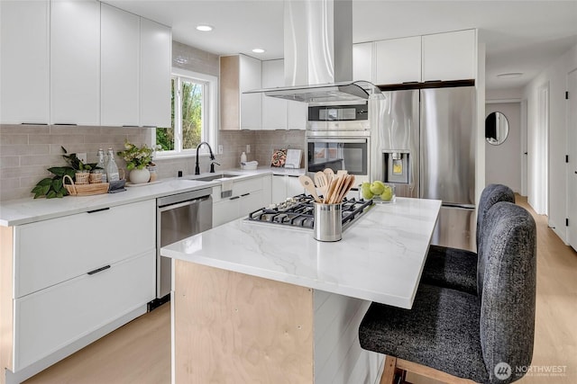 320 178th Pl SW, Bothell, WA 98012 - kitchen with exhaust hood, stainless steel appliances, modern cabinets, light wood finished floors, and recessed lighting