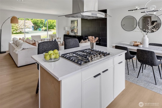 320 178th Pl SW, Bothell, WA 98012 - kitchen featuring island range hood, open floor plan, stainless steel gas cooktop, and light wood-style floors