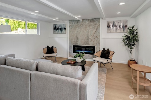 320 178th Pl SW, Bothell, WA 98012 - living area with beam ceiling, a fireplace, light wood-style floors, and recessed lighting