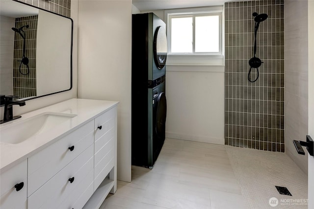 320 178th Pl SW, Bothell, WA 98012 - full bathroom featuring stacked washer / drying machine, a tile shower, and vanity