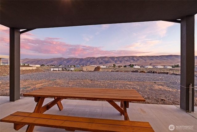 101 Wren Loop SW, Mattawa, WA 99349 - patio terrace at dusk featuring a mountain view and a patio