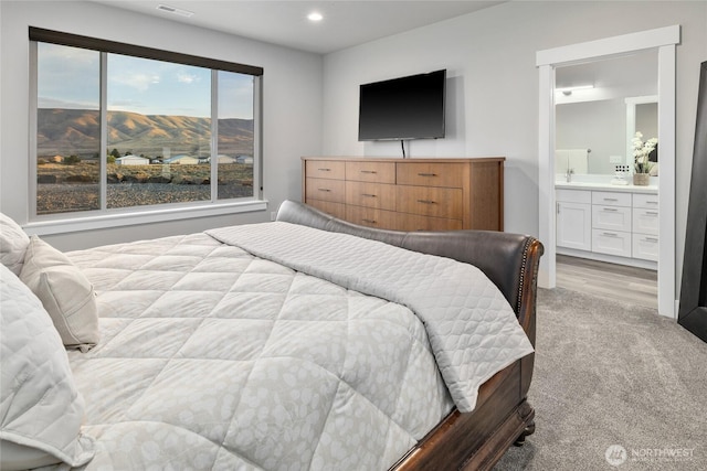 101 Wren Loop SW, Mattawa, WA 99349 - bedroom with carpet flooring, connected bathroom, and recessed lighting