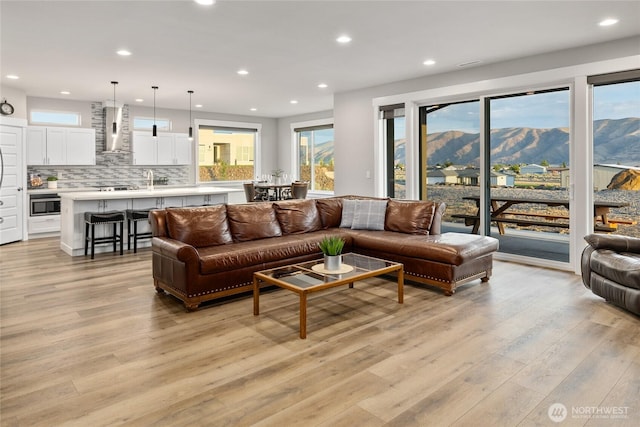 101 Wren Loop SW, Mattawa, WA 99349 - living area featuring a mountain view, light wood-style floors, and recessed lighting