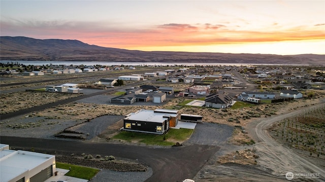 101 Wren Loop SW, Mattawa, WA 99349 - aerial perspective of suburban area featuring a water and mountain view