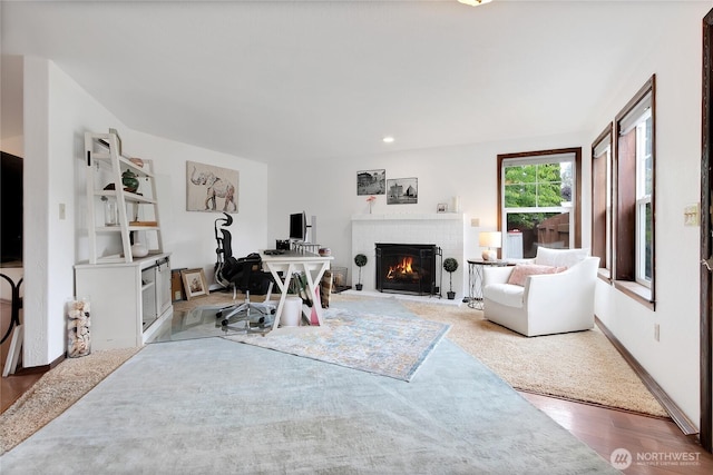 10208 D St E, Tacoma, WA 98445 - living area with a brick fireplace, wood finished floors, and an office area