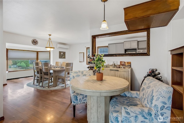 10208 D St E, Tacoma, WA 98445 - dining room featuring a wall mounted air conditioner and wood finished floors