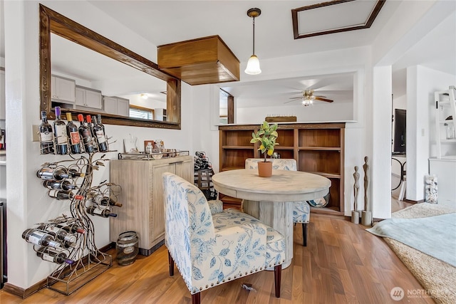 10208 D St E, Tacoma, WA 98445 - dining room with wood finished floors, a ceiling fan, and attic access
