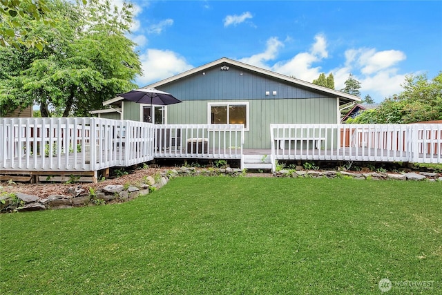 10208 D St E, Tacoma, WA 98445 - back of property with a deck and a lawn