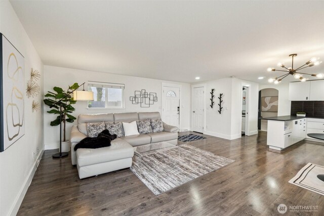 5467 16th Ave SW, Seattle, WA 98106 - living room with arched walkways, recessed lighting, dark wood-type flooring, and a chandelier