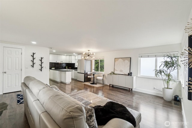 5467 16th Ave SW, Seattle, WA 98106 - living room with a chandelier, wood finished floors, and recessed lighting