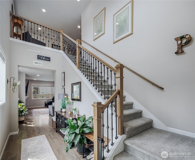 1448 101st Ave SE, Lake Stevens, WA 98258 - staircase featuring wood finished floors, recessed lighting, and a high ceiling