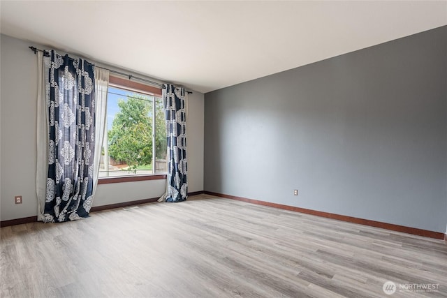15204 Kayla St SE, Yelm, WA 98597 - unfurnished room with light wood-type flooring and baseboards