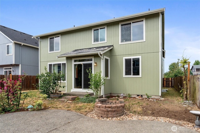 15204 Kayla St SE, Yelm, WA 98597 - view of front of house featuring a fenced backyard and an outdoor fire pit