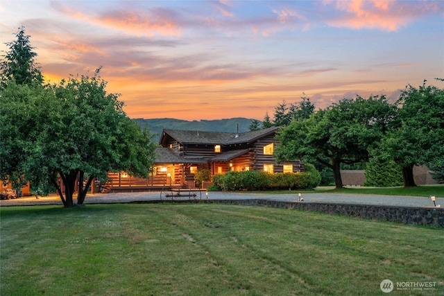 3130 S Bay Vista Dr, Sedro Woolley, WA 98284 - back of property featuring log siding, a lawn, and a mountain view