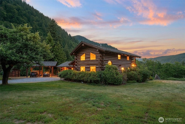 3130 S Bay Vista Dr, Sedro Woolley, WA 98284 - rear view of house with a yard, a forest view, and log siding