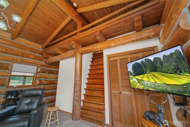 3130 S Bay Vista Dr, Sedro Woolley, WA 98284 - carpeted living room with wooden ceiling, log walls, and stairs