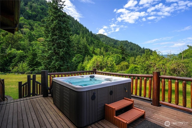 3130 S Bay Vista Dr, Sedro Woolley, WA 98284 - wooden deck with a hot tub and a wooded view