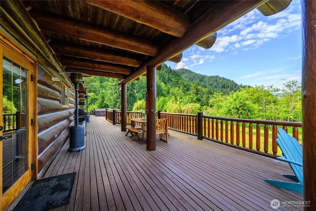 3130 S Bay Vista Dr, Sedro Woolley, WA 98284 - wooden terrace with a forest view and outdoor dining space