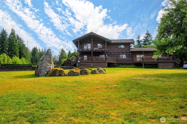3130 S Bay Vista Dr, Sedro Woolley, WA 98284 - rear view of house with a deck, a lawn, and log siding