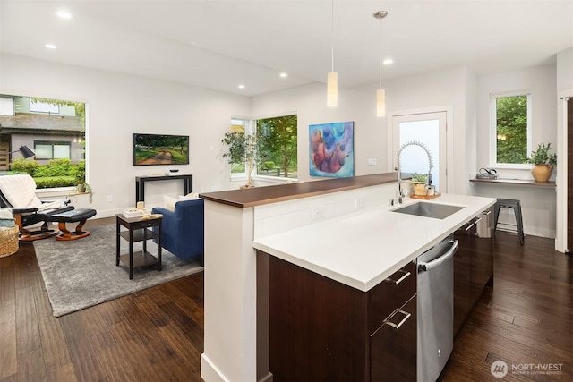 1408 Hinoki Walk NE, Issaquah, WA 98029 - kitchen with stainless steel dishwasher, dark wood-style floors, recessed lighting, modern cabinets, and an island with sink