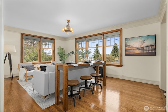 405 Prospect St Unit 201, Seattle, WA 98109 - living area with a chandelier, wood finished floors, and ornamental molding