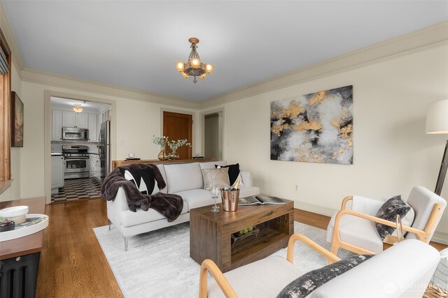 405 Prospect St Unit 201, Seattle, WA 98109 - living area featuring wood finished floors, a chandelier, and ornamental molding