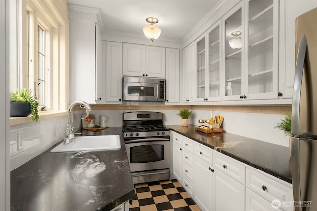 405 Prospect St Unit 201, Seattle, WA 98109 - kitchen with stainless steel appliances, tile patterned floors, and white cabinets