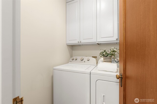405 Prospect St Unit 201, Seattle, WA 98109 - washroom with cabinet space and washer and dryer