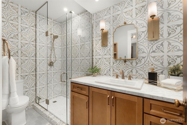 405 Prospect St Unit 201, Seattle, WA 98109 - full bathroom with vanity, a shower stall, and wallpapered walls