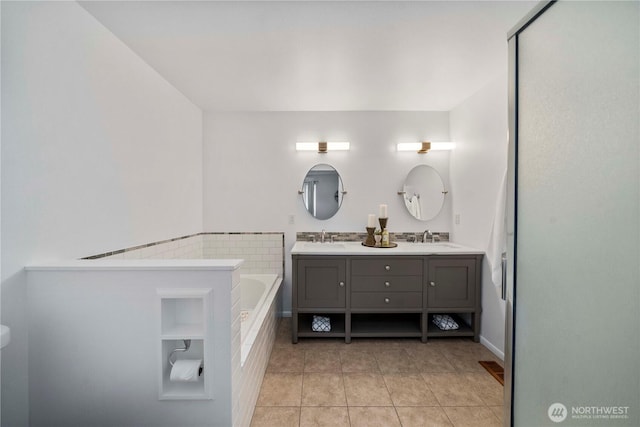608 14th St SW, Puyallup, WA 98371 - bathroom featuring tile patterned floors, double vanity, and a garden tub