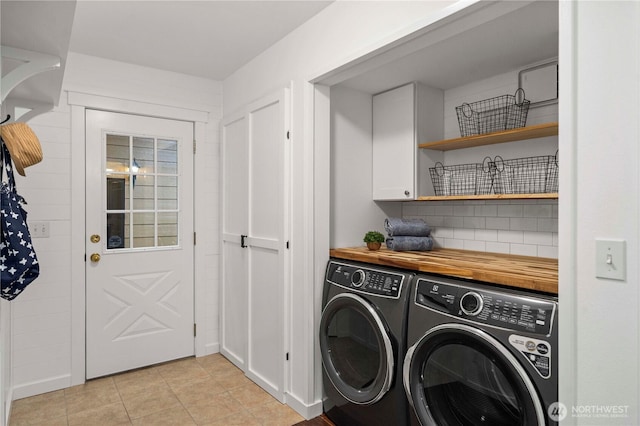 608 14th St SW, Puyallup, WA 98371 - laundry area with washer and dryer, cabinet space, and light tile patterned floors