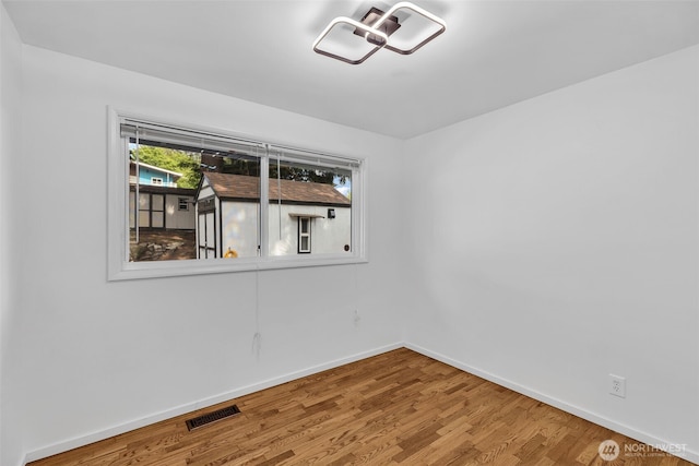 18256 45th Ave S, Seatac, WA 98188 - empty room featuring baseboards and wood finished floors