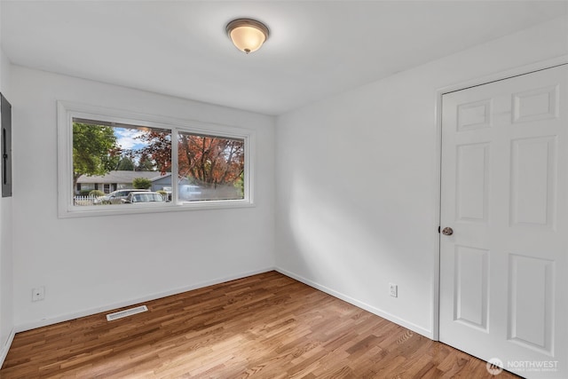18256 45th Ave S, Seatac, WA 98188 - unfurnished room with wood finished floors and baseboards
