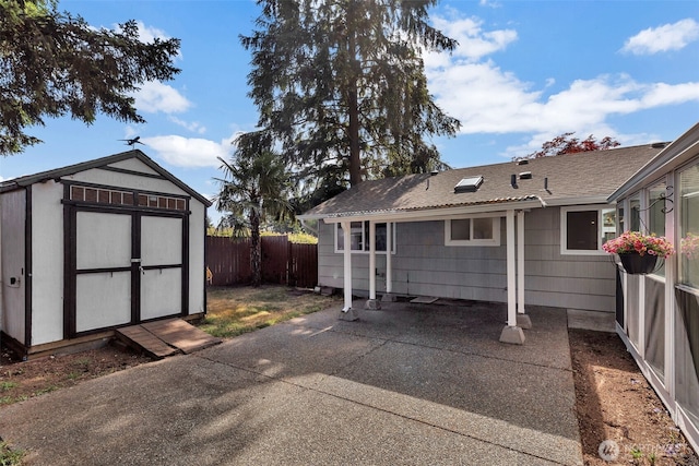 18256 45th Ave S, Seatac, WA 98188 - rear view of house with a storage unit and a patio area