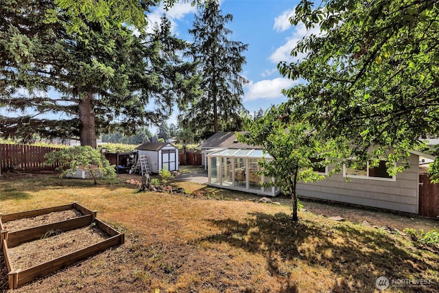 18256 45th Ave S, Seatac, WA 98188 - fenced backyard featuring a garden, a greenhouse, and a shed