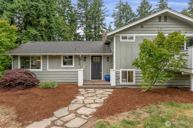 10656 SE 287th St, Auburn, WA 98092 - tri-level home featuring board and batten siding, a chimney, and roof with shingles