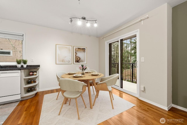 17424 NE 88th Pl Unit B24, Redmond, WA 98052 - dining area featuring light wood-type flooring and rail lighting
